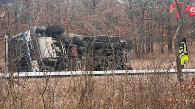 Photos: Garbage truck overturns in Sand Springs