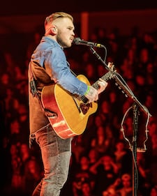 Check out the photos from Zach Bryan's concert at the BOK Center on December 12th, 2024.