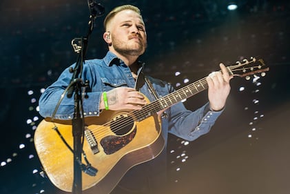 Check out the photos from Zach Bryan's concert at the BOK Center on December 12th, 2024.