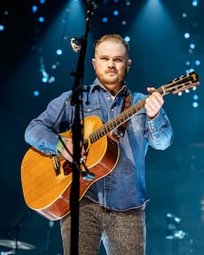 Check out the photos from Zach Bryan's concert at the BOK Center on December 12th, 2024.