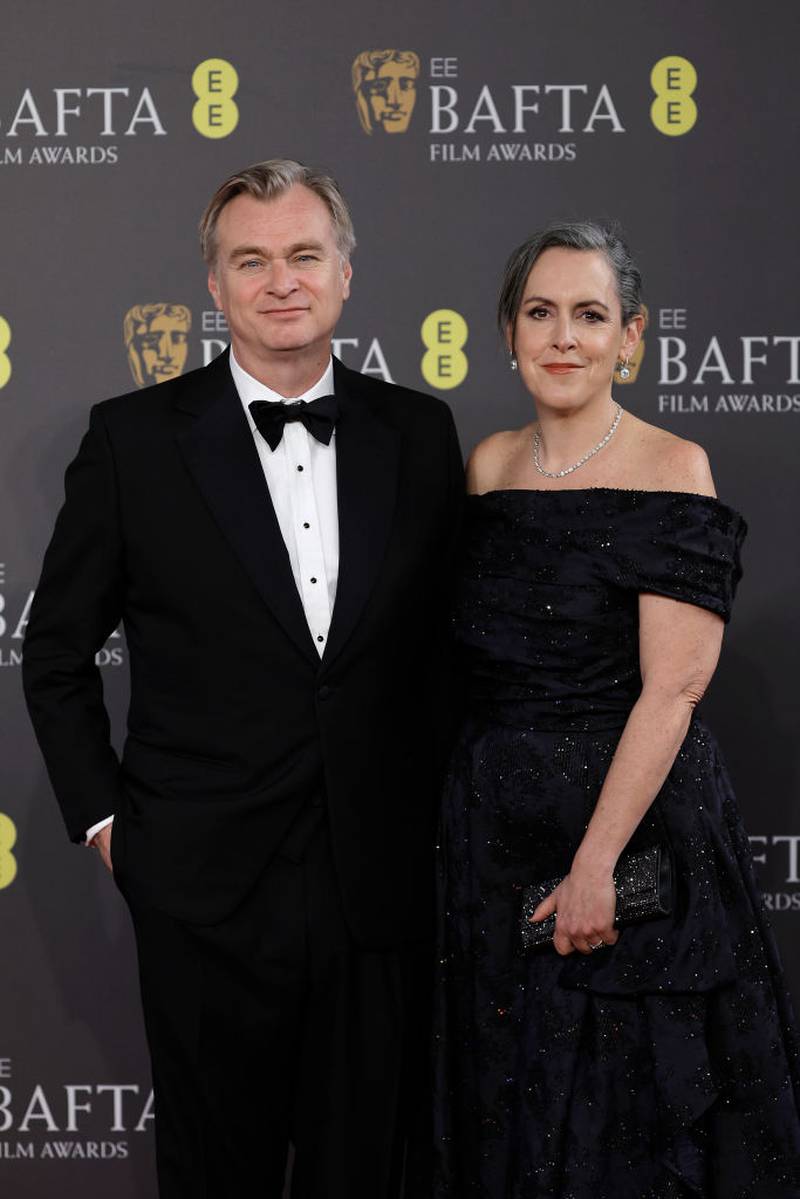 LONDON, ENGLAND - FEBRUARY 18: Christopher Nolan (L) and  Emma Thomas attends the 2024 EE BAFTA Film Awards at The Royal Festival Hall on February 18, 2024 in London, England. (Photo by John Phillips/Getty Images)